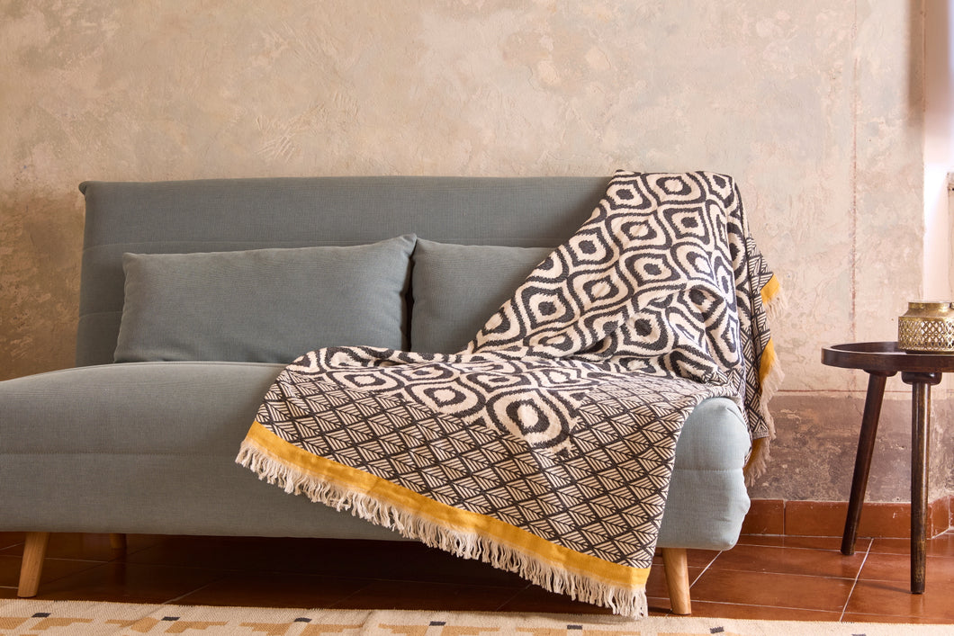 Baumwolldecke aus Jacquard mit stilvollem Augenmotiv